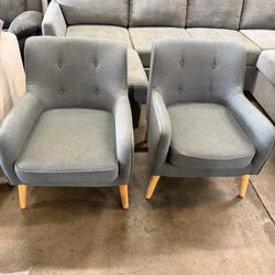 Gray Stewart tufted fabric chairs with comfortable padded seats and wooden legs. Perfect for a living room $100 each