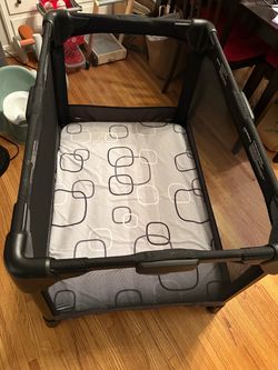 4 Moms pack n play play yard with extra mattress, changing table and travel bag