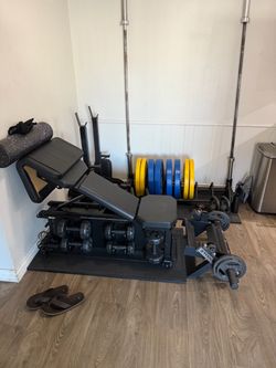 Home Gym Setup with Bench, Weights, and Barbells