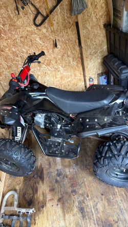 125cc kid quad like new has title
