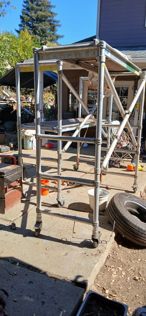 Two Upright Folding Aluminum Scaffolds