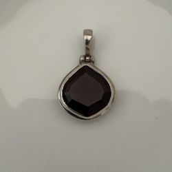 Sterling silver purple teardrop gemstone pendant with JGD signature of jewelry artisan