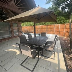 Backyard Table, Chair, Umbrellas And Umbrella Support 