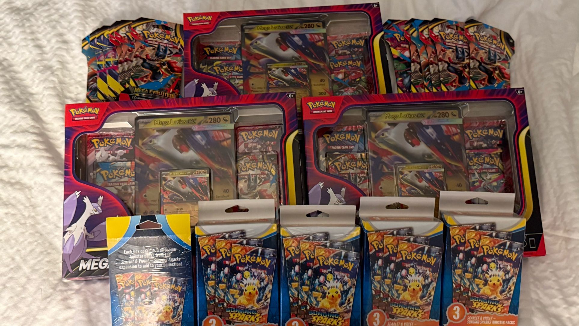 🔥 Pokémon Mega Latias EX 3 Boxes + 12 Mega Booster Packs + 5 Surging Sparks 3-Pack Boxes 🔥