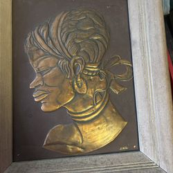 Signed framed copper African goddess