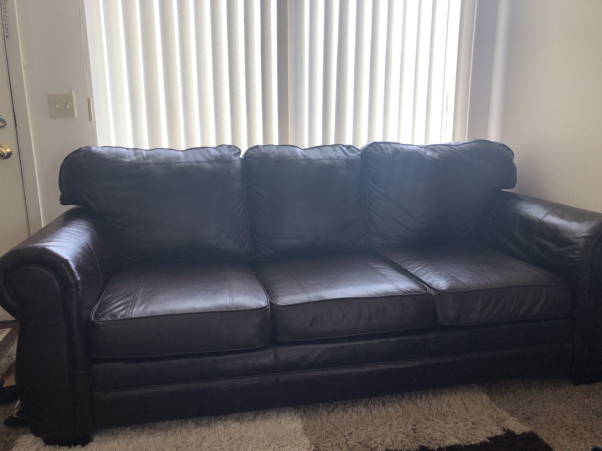 2 leather couches , 3 set tables,and a leather chair
