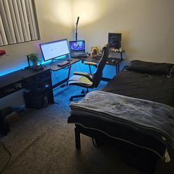 Black L Shape Table, A Desk, and Twin XL Bed