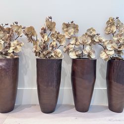 Set of wooden vases with flowers