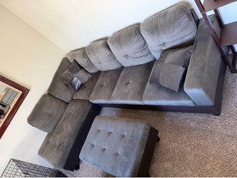 Brown sectional with ottoman.