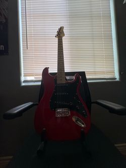 Glarry electric red guitar and stand