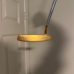 Ping anser 4 gold blade putter.
