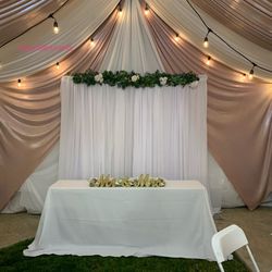 Tent——tables——chairs——tablecloth——draping