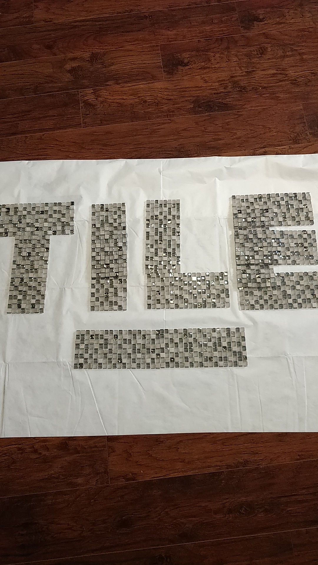 Glass mosaic tile with gray / silver travertine