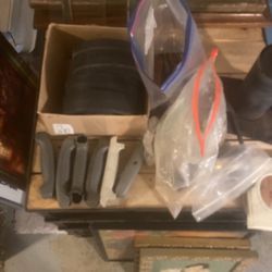 Weber Kettle handles Weber Kettle wheels, a bunch of Weber Kettle parts and smoker parts in bags and a chimney for a barrel smoker along with tith the
