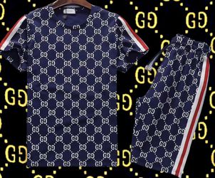 Gucci track suit shirt and shorts