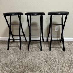 Folding bar stools in black metal