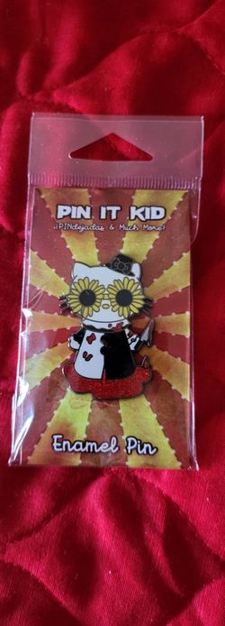 A white cartoon cat (Hello Kitty) wearing Art the Clown's signature mini top hat, sunflower glasses, black-and-white jester/clown outfit, holding a sm