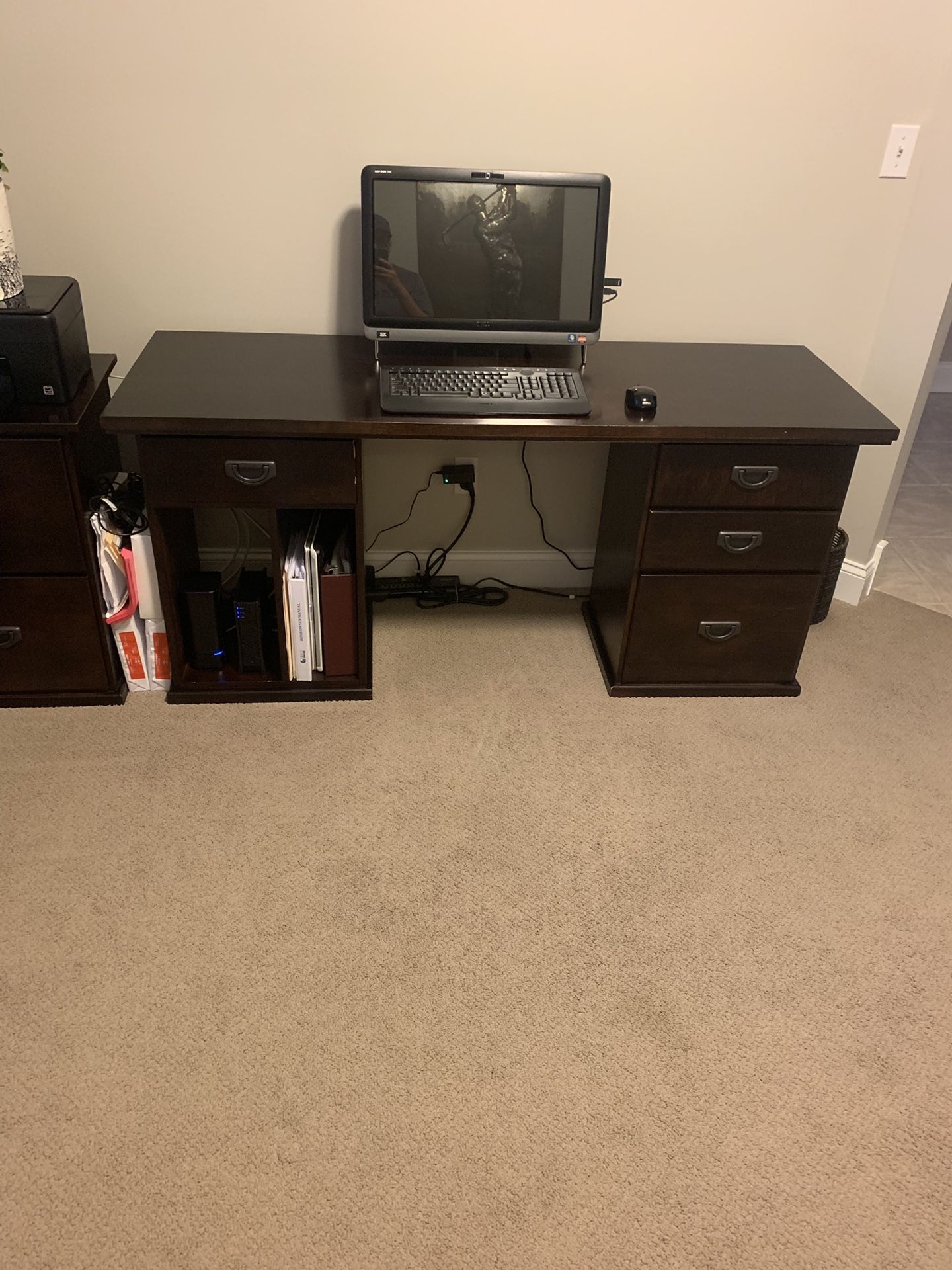 Office furniture for sale. Items include 2 desks, file cabinet, and a hutch. All pieces are interchangeable and are in pristine condition. The des