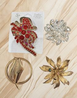 BUNDLE OF 4 LARGE BROOCHES (the goldtone is missing one red stone).2”