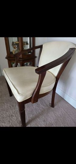 Mahogany barrel-back dining chair with cream upholstered seat