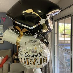 Two Helium Filled Graduation Balloons