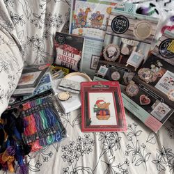 cross stitch patterns, thread, and other supplies