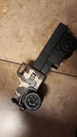 VINTAGE LOOKING CAMOUFLAGE TOY TRUCK $8