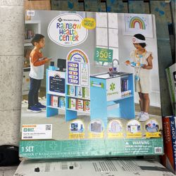 Rainbow Health Center Members Mark For Kids 