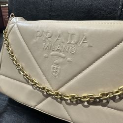 prada woman’s gold chain crossbody purse