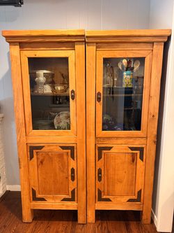 Two hutch/curio cabinets