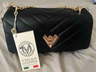 Fabulous black quilted vegan leather exterior.