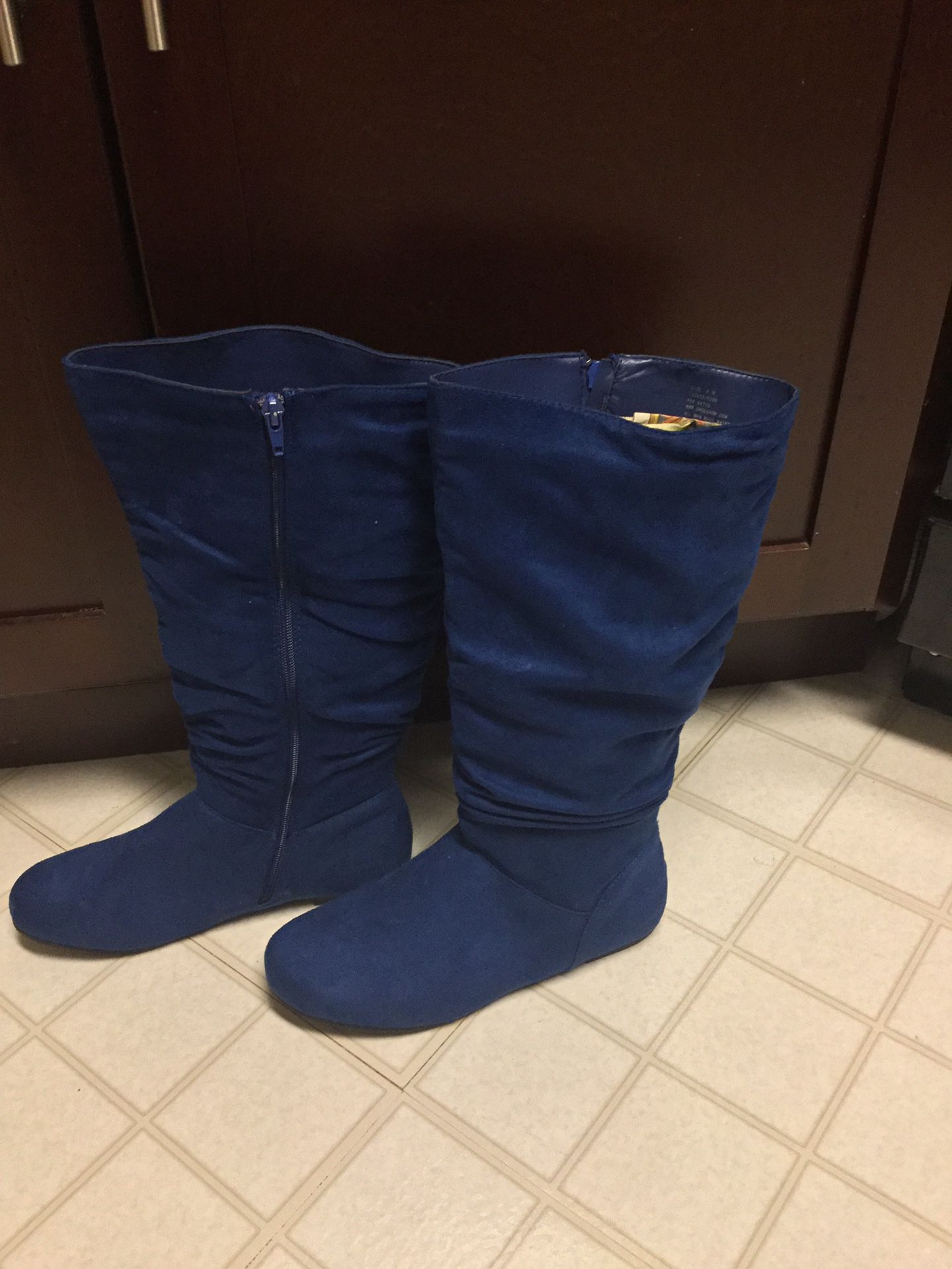 Size 8 women’s blue suede mid calf boots. BRAND NEW!!