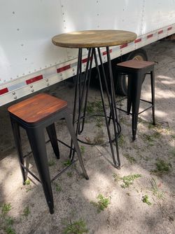 Round bar table with two matching stools, metal frame. Located Mount Dora Fla 32757