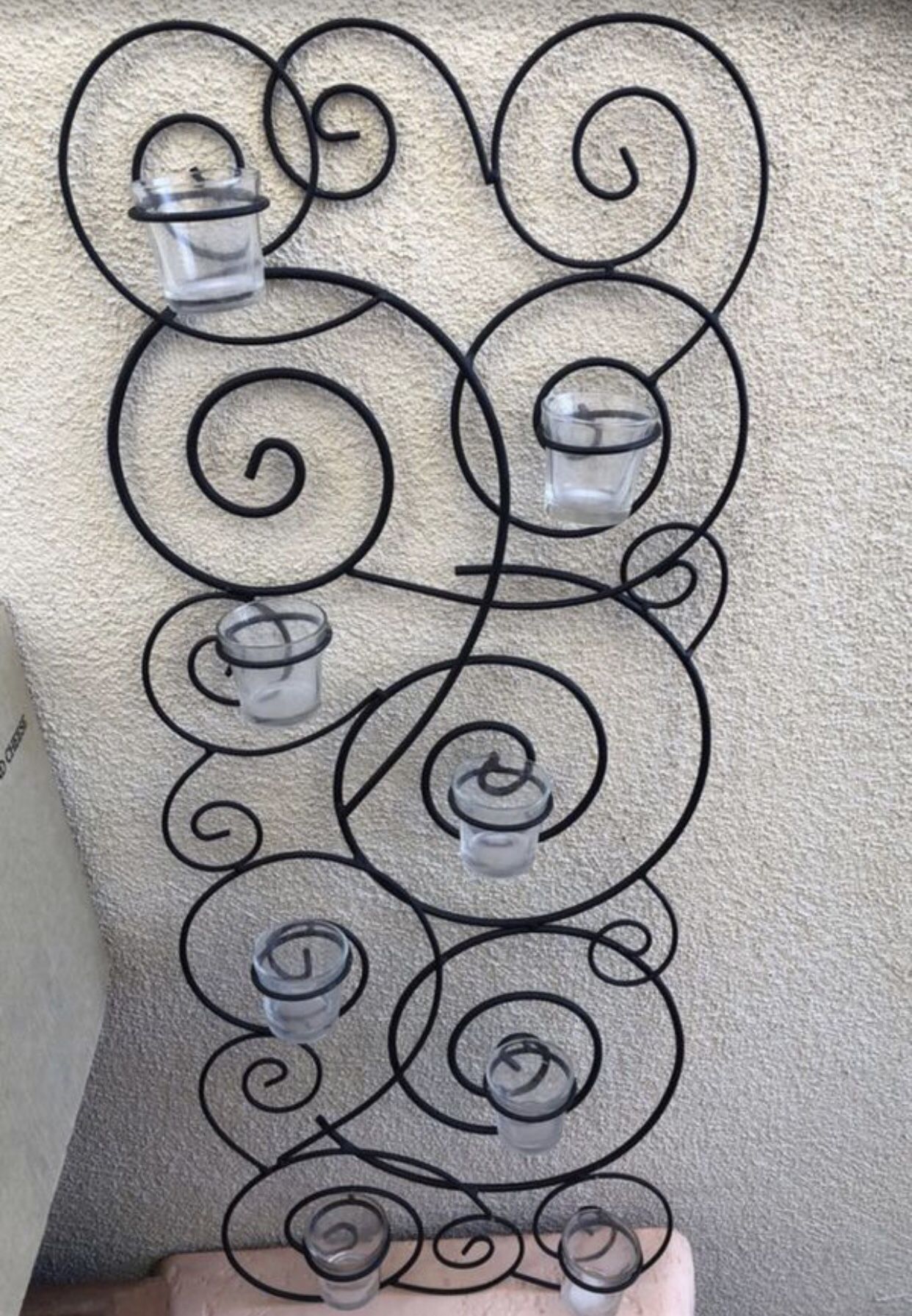 Black iron hanger, with 8 glasses candle holders . Still brand new. Size 35,5” T X 14” W. Look new. Price $28 only.