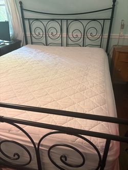 Queen bed frame with mattress and box spring