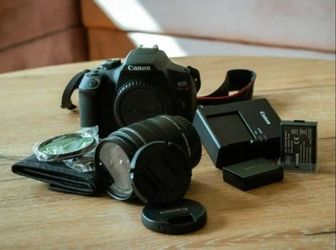 Canon Rebel T7 camera body, lens, filters strap and batteries