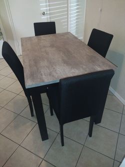 Dinner table with 4 chairs perfect for a small apartment... Brand New