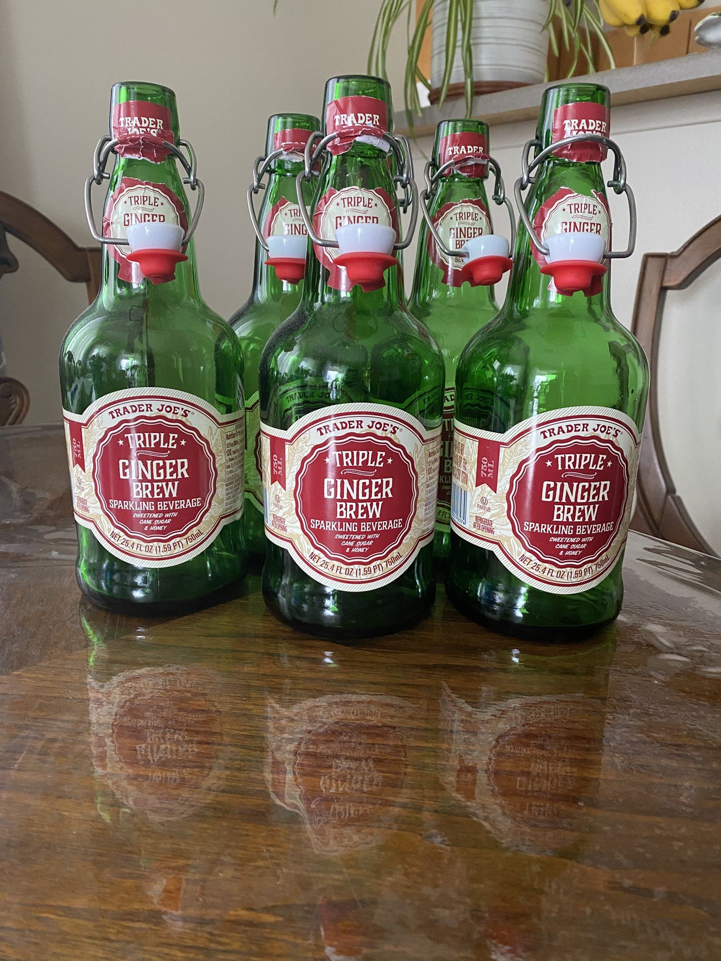 6 Green Glass Bottles With Lids.