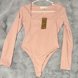 Medium Pink long sleeve bodysuit 
