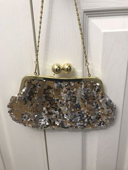 Nice dressy purse color gold and silver , like new