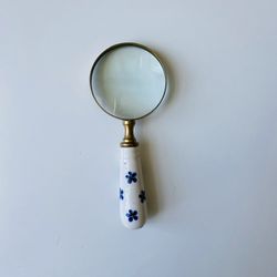 Vintage Antique loupe. Bronze; porcelain; high polished glass. Very functional great decoration for any home. Like new condition.