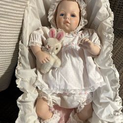 Fine porcelain Baby Doll with bassinet and accessories