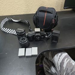 Olympus Camera, 2 Lens 3 Batteries, Flash Attachment and Bag 
