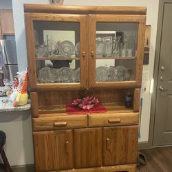Beautiful Wooden Mirrored Hutch With Glass Doors, Shelving, drawers, cabinet space and recessed lighting 