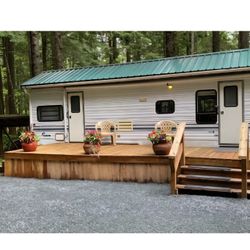 Camping Lot With Camp Trailer And Shed