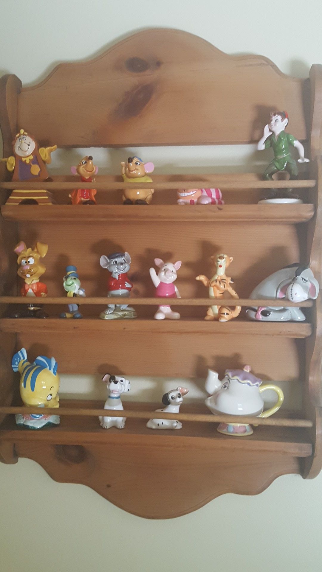 Disney figurines with shelf