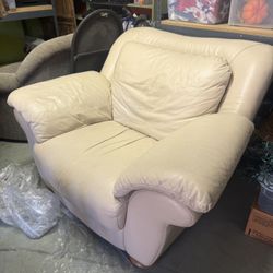 Two leather arm chairs and matching Ottomans