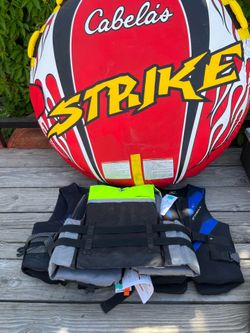 Boat, tube pull or float  toy, and a few  life jackets selling separately