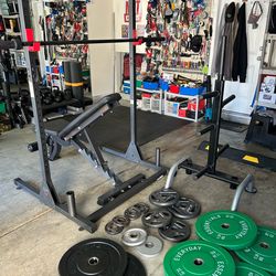 Weightlifting equipment. Squad rack. Bench. Weight plate rack. Over 200 pounds of weight.