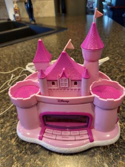 Pink princess castle alarm clock with digital display, clock, radio, alarm, projector light, approx 8" tall x 8" wide
